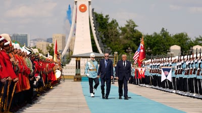 Mr Trump walks alongside Mr Erdogan at the Bestepe Presidential Palace in the Turkish capital. Getty Images