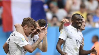 France forward Antoine Griezmann, left, celebrates with defender Laurent Koscielny, second left, and midfielder Blaise Matuidi after their second goal against Nigeria on Monday at the 2014 World Cup. Franck Fife / AFP