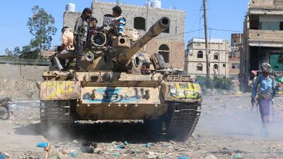 Yemeni tribal fighters take position on the first day of a new offensive against Houthi rebels in Yemen’s Taez province on November 16, 2015. Abdulnasser Alseddik / AP Photo
