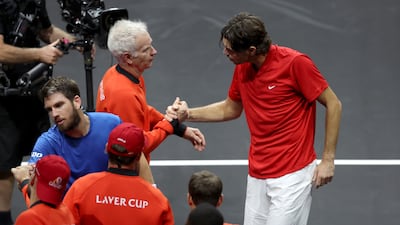 Taylor Fritz shakes hands with Team World captain John McEnroe after victory over Cameron Norrie. Getty