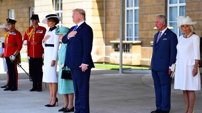 Britain's Queen Elizabeth II (4L) stands with US President Donald Trump (C), US First Lady Melania Trump (3L), Britain's Prince Charles, Prince of Wales (2R) and Britain's Camilla, Duchess of Cornwall as they listen to the US national anthem during a welcome ceremony at Buckingham Palace in central London. AFP
