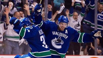 Daniel Sedin, right, has conceded his team are not good enough for the three-on-three overtime play and are always trying to run out the clock for the shoot-out. Darryl Dyck / AP Photo