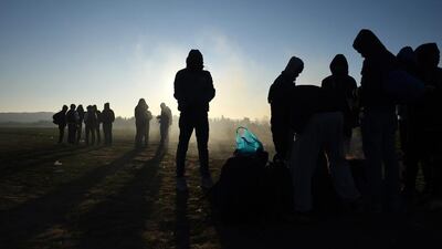 Stranded migrants gather at the Greek-Macedonian border, near the northern Greek village of Idomeni. Giannis Papanikos / AP Photo