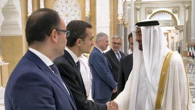 Sheikh Mohamed bin Zayed greets an Italian delegation member during a reception held at the Presidential Palace. Hamad Al Kaabi / Ministry of Presidential Affairs. Hamad Al Kaabi / Ministry of Presidential Affairs