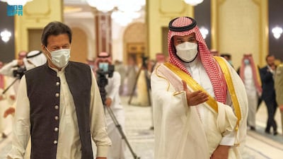Saudi Arabia's Crown Prince Mohammed bin Salman welcomes Pakistani Prime Minister Imran Khan for talks at the royal court at Al Salam Palace in Jeddah. SPA