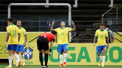 Roberto Firmino celebrates scoring their third goal. Reuters