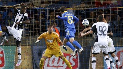 Bate Borisov's Mikhail Gordeichuk goes for a header before scoring the lone goal against Partizan Belgrade in a 1-0 Champions League play-off first leg win on Tuesday night in Minsk, Belarus. Vasily Fedosenko / Reuters