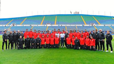 President Abdel Fattah El Sisi poses with the Egyptian football team at their training camp in Cairo ahead of the Africa Cup of Nations being hosted by Egypt. AFP