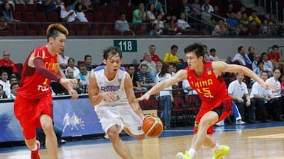Taiwan’s Lin Chih-Chieh, centre, is guarded by China’s Zhou Peng, right, and Sun Yue. Romeo Ranoco / Reuters