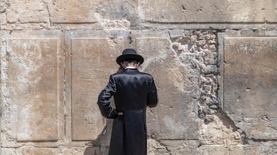 An ultra-Orthodox Jewish man prays outside the Ibrahimi Mosque, a holy site for Muslims and Jews, in Hebron, in the occupied West Bank. AFP