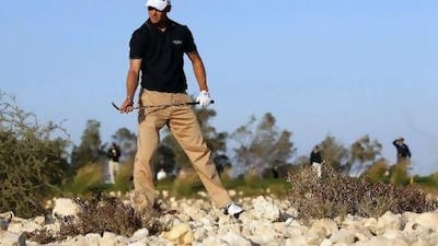 Germany's Martin Kaymer drove into the rocks on the 15th hole during a day of frustration at the Qatar Masters yesterday.