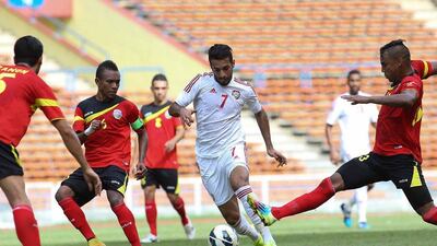 UAE striker Ali Mabkhout, centre, in action during the victory over East Timor in Kuala Lumpur. Kamarul Akhir / AFP / June 16, 2015