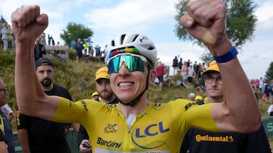 Tadej Pogacar celebrates after sealing victory on Stage 14 of the 2026 Tor de France. EPA