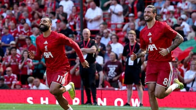 Liverpool's Mohamed Salah and Dominik Szoboszlai at Anfield. EPA