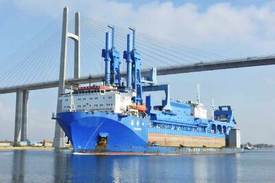 The new dredger named "Hussein Tantawy", the largest in the Middle East, arrives in the Suez Canal, onboard the "Tai An Kou" vessel, coming from Rotterdam port in Netherlands, July 27, 2021.