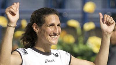 Virginie Razzano celebrates after defeating Kaia Kanepi during the semi-finals of the Dubai Tennis Championships.