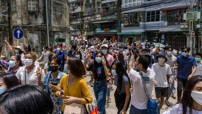 Protesters make the three-finger salute during a demonstration against the military coup in Yangon's Sanchaung township in Myanmar. AFP