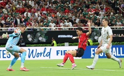South Korea substitute Oh Hyeongyu, centre, steers the ball past Czech Republic goalkeeper Matej Kovar. EPA
