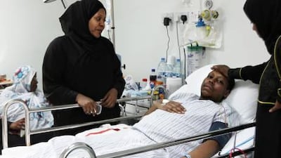 Ahmed Khamis Feyrous Mohammed Al Ali is joined by family members as he receives treatment at Rashid Hospital in Dubai. His condition was twice misdiagnosed.