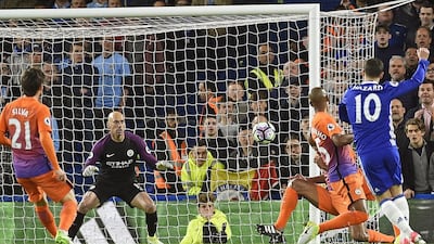 Chelsea's Eden Hazard, right, scores Chelsea's first goal. Gerry Penny / EPA