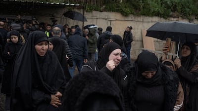 Women mourn during the funeral of Lebanese journalists killed in an Israeli strike. Reuters