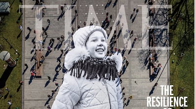 The cover of 'Time' magazine's 'The Resilience of Ukraine' issue features JR's artwork, a 45-metre tarp print of a photograph of young Ukrainian refugee Valeriia. Photo: Time