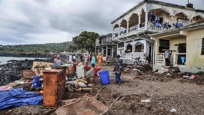 Residents gather their belongings on April 27, 2019 in Fumbuni, 56km south of Comoros capital Moroni, following the passage of the Cyclone Kenneth. Thousands of people in remote areas of storm-lashed Mozambique were homeless Saturday and bracing for imminent flooding, food and water shortages as Cyclone Kenneth flattened entire villages, leaving rescuers struggling to reach them. AFP