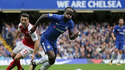 Chelsea's Victor Moses breaks past Arsenal defender Sead Kolasina. Tim Ireland / AP Photo