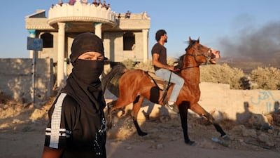 Palestinian protesters take part in a demonstration against the newly built Israeli settlers' outpost of Eviatar in the town of Beita, near the occupied West Bank city of Nablus, on June 24. AFP