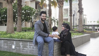 Mohsin Khan, 31, known as Emkwan, with wife Nabeelah Hussain and son Zayn Khan, also video stars. Mona Al Marzooqi / The National