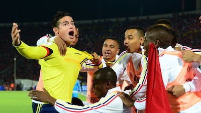 Colombia’s James Rodriguez celebrates his goal against Chile with teammates on Thursday night in their 2018 World Cup qualifying match in Santiago. Martin Bernetti / AFP
