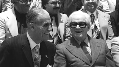 Phalangist Party founder Pierre Gemayel, left, chats with former Lebanese president Camille Chamoun, during a military parade in East Beirut on May, 25 1980. AFP