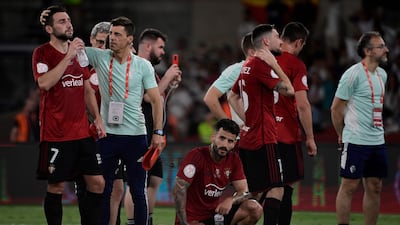 Osasuna players look dejected after losing the Copa del Rey final. AFP