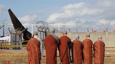 Buddhist monks mourn lives lost in Sunday's Jeju Air crash, the worst aviation disaster on South Korean soil. AFP