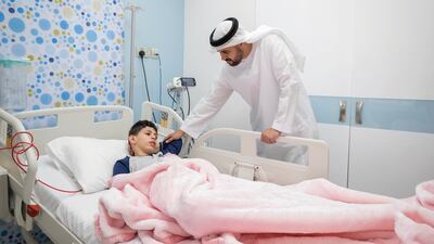 Sheikh Theyab bin Mohamed, Chairman of the Office of Development and Martyrs' Families Affairs at the Presidential Court, visiting injured Palestinian children and their families at UAE hospitals on Tuesday. All photos: Abu Dhabi Media