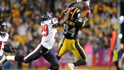 Pittsburgh Steelers wide receiver Antonio Brown, right, makes a catch past Houston Texans defensive back Andre Hal, left, during Pittsburgh's win over Houston in the NFL on Monday night. Don Wright / AP / October 20, 2014