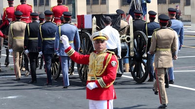 Honour guards accompany the horse-drawn carriage transporting the flag-draped coffin of former Egyptian President Hosni Mubarak. EPA
