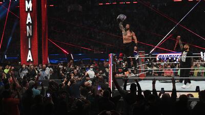 Roman Reigns is successful in defending the WWE Universal Championship in a triple threat match against Daniel Bryan and Edge. Courtesy WWE