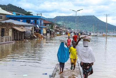 People stranded due to floods following several days of downpours In Kogi Nigeria, on October 6. Thousands of travelers remained stranded in Nigeria's northcentral Kogi state after major connecting roads to other parts of the West African nation were submerged in floods, locals and authorities said Thursday. AP