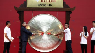 Alibaba rival JD.com made its Hong Kong Stock Exchange trading debut on Thursday. US President Donald Trump has cautioned that companies might move their stock listings to London or Hong Kong if the US got tougher on compliance. Photo: AP