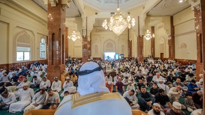 Worshippers gather for Friday prayers at Al Qasba mosque in Sharjah. Ahmed Ramzan / The National