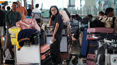 A stranded passenger at the airport. Reuters