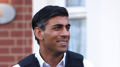 Rishi Sunak watches an immigration raid in north-west London in June. The British Prime Minister plans to fulfil his five promises to overhaul his substantial polling deficit. Getty