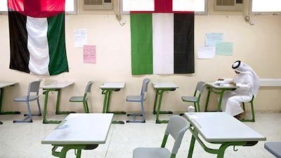 An Emirati student takes an exam. Waha Capital plans to invest in education in Abu Dhabi as it believes the emirate is undersupplied. Christopher Pike / The National