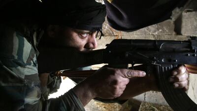 A Syrian fighter near the town of Tal Hajar in northern Aleppo province, a few kilometres from areas controlled by a Kurdish-led coalition. AFP