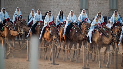 Camel riders participate in the parade, which served as the finale for the UAE's Eid Al Etihad celebrations