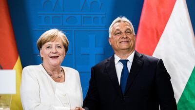 All friends now: Angela Merkel shakes hands with Hungarian counterpart Viktor Orban after clashing in the past over EU migration policy. Bloomberg