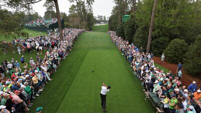 Tiger Woods hits his tee-shot on the 18th hole at Augusta. EPA