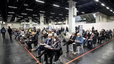People wait to be vaccinated in Cologne, Germany. AP