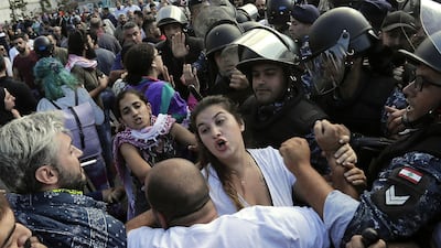 Lebanese security forces intervene between clashing demonstrators and counter-protesters in the centre of the capital Beirut during the 13th day of anti-government protests. AFP
